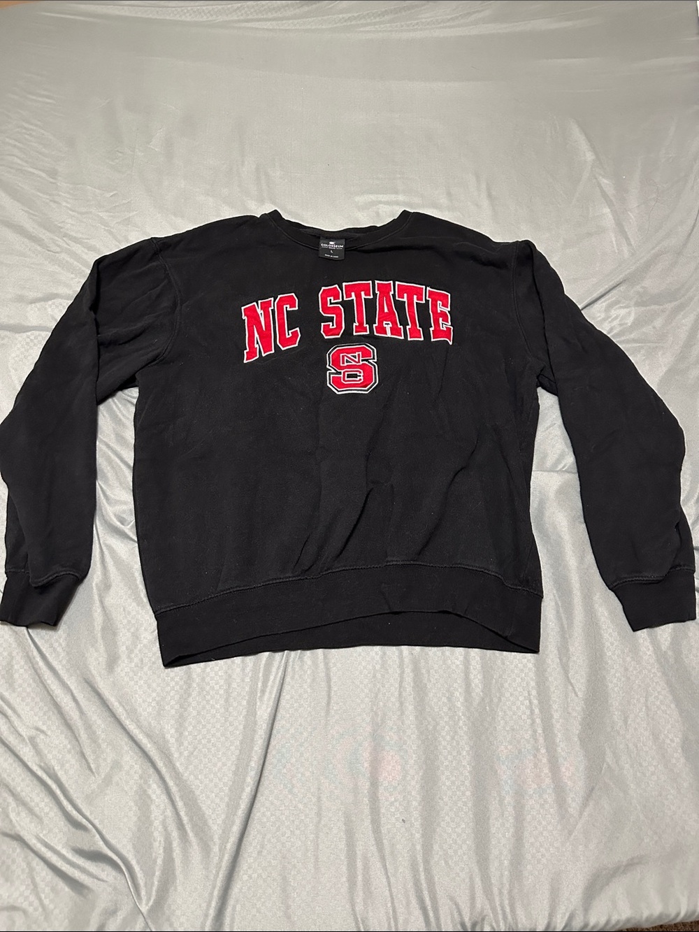 Colosseum Black Crewneck Sweatshirt with Red NC STATE Logo